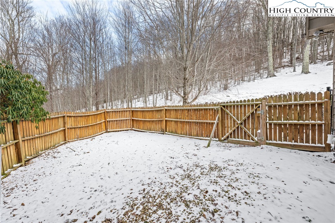 295 Supreme Golden Road Banner Elk, NC 28604 - Photo 32 of 40 a view of a backyard with wooden fence