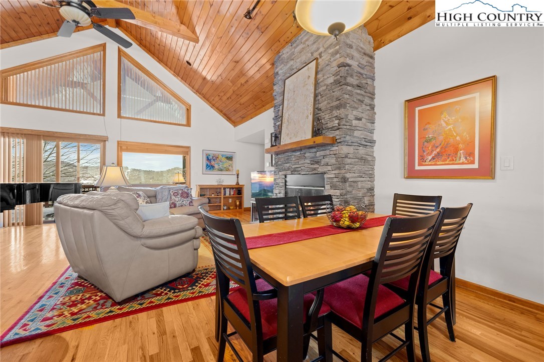 295 Supreme Golden Road Banner Elk, NC 28604 - Photo 8 of 40 a dining room with furniture and a fireplace