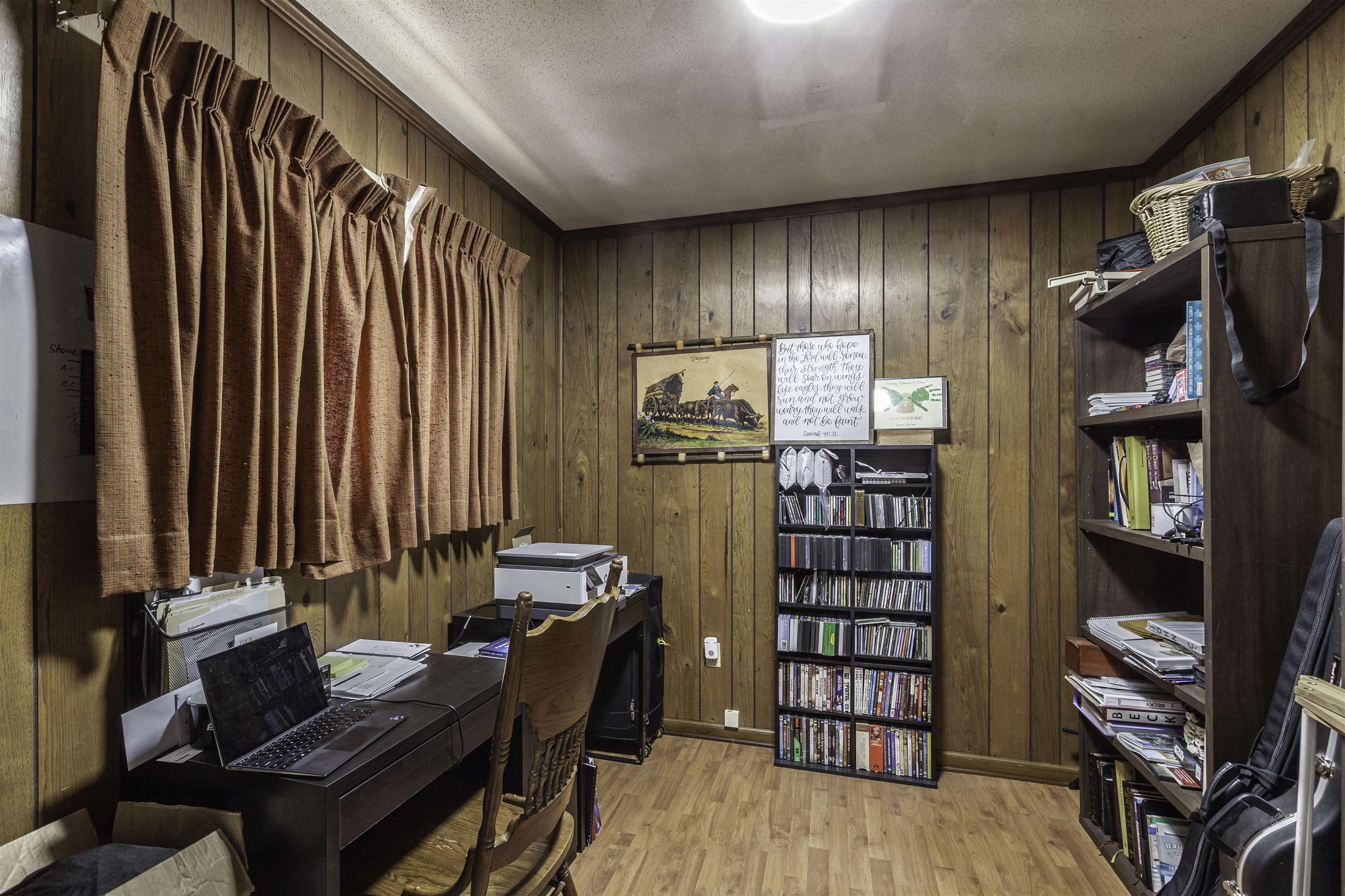 3462 Fox Meadows Road Memphis, TN 38115 - Photo 12 of 23 a view of a workspace with furniture and clothes