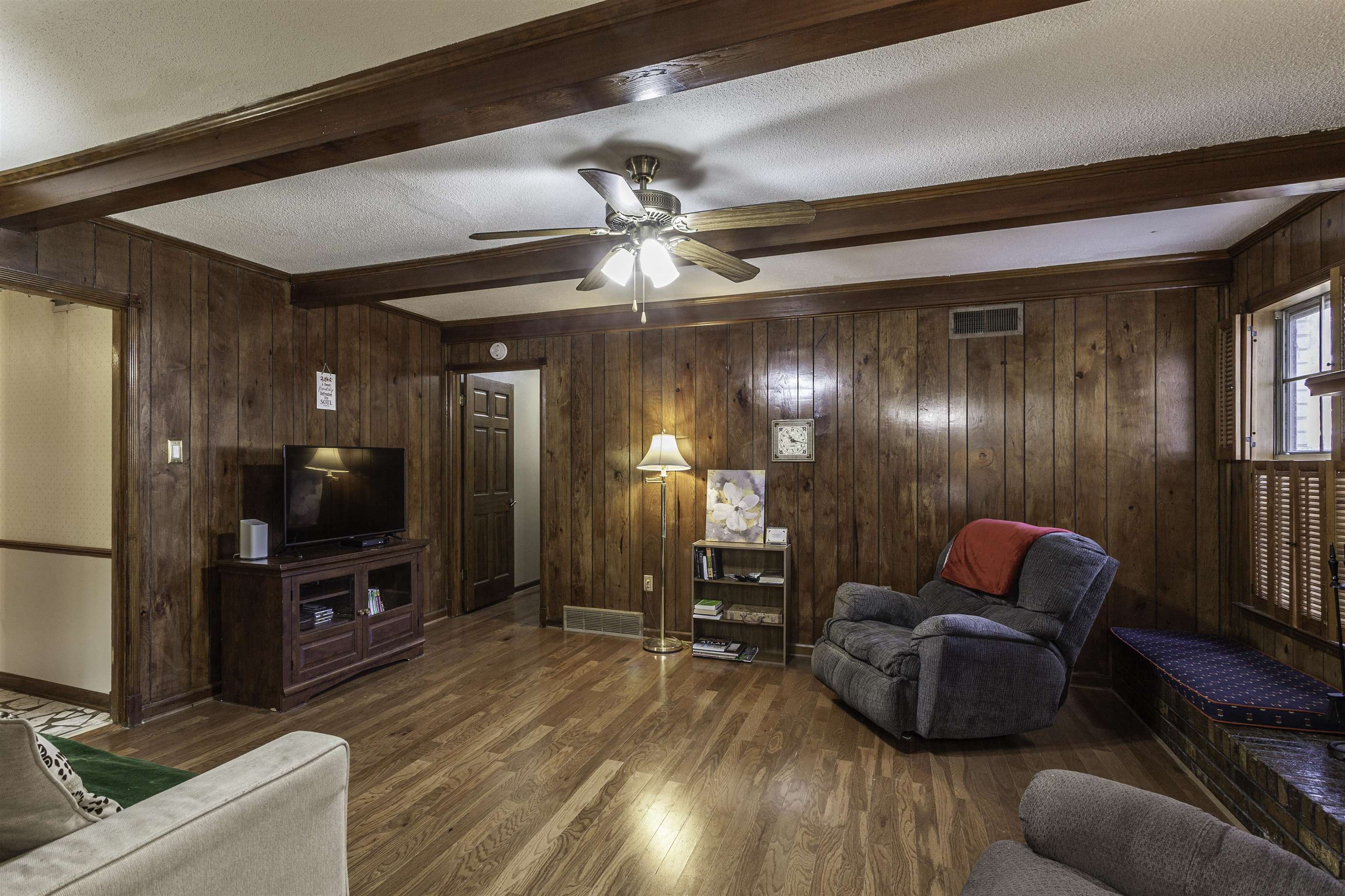 3462 Fox Meadows Road Memphis, TN 38115 - Photo 13 of 23 a living room with furniture gym equipment and a flat screen tv