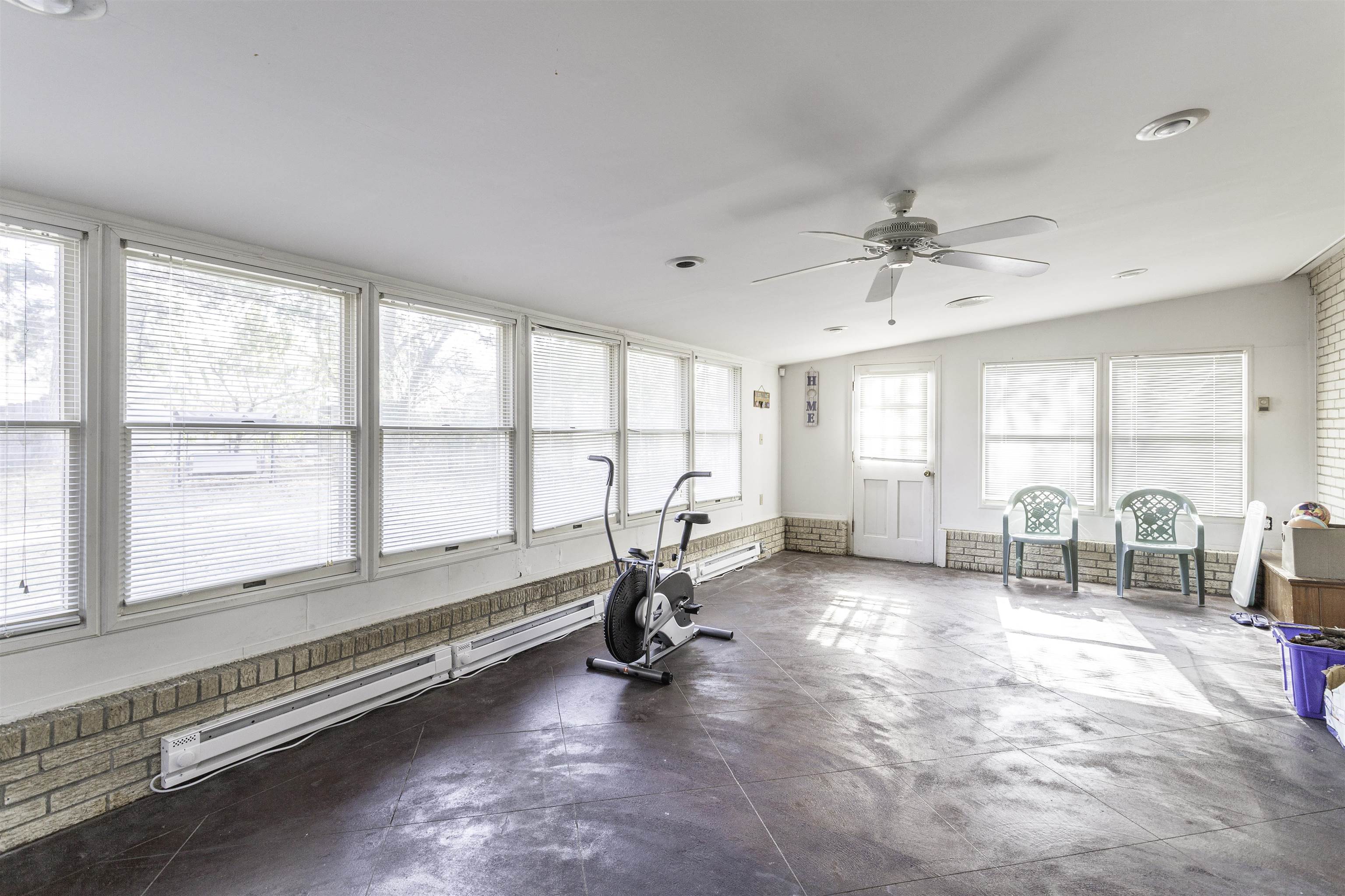 3462 Fox Meadows Road Memphis, TN 38115 - Photo 20 of 23 a view of a room with gym equipment and large window