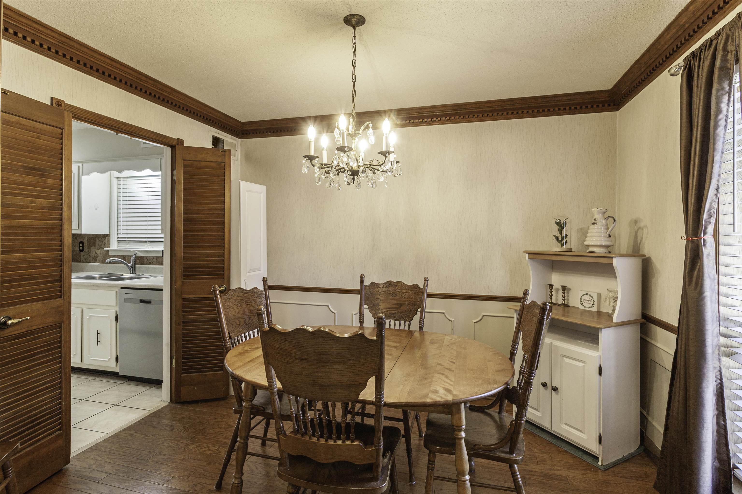 3462 Fox Meadows Road Memphis, TN 38115 - Photo 6 of 23 a view of a dining room with furniture and wooden floor