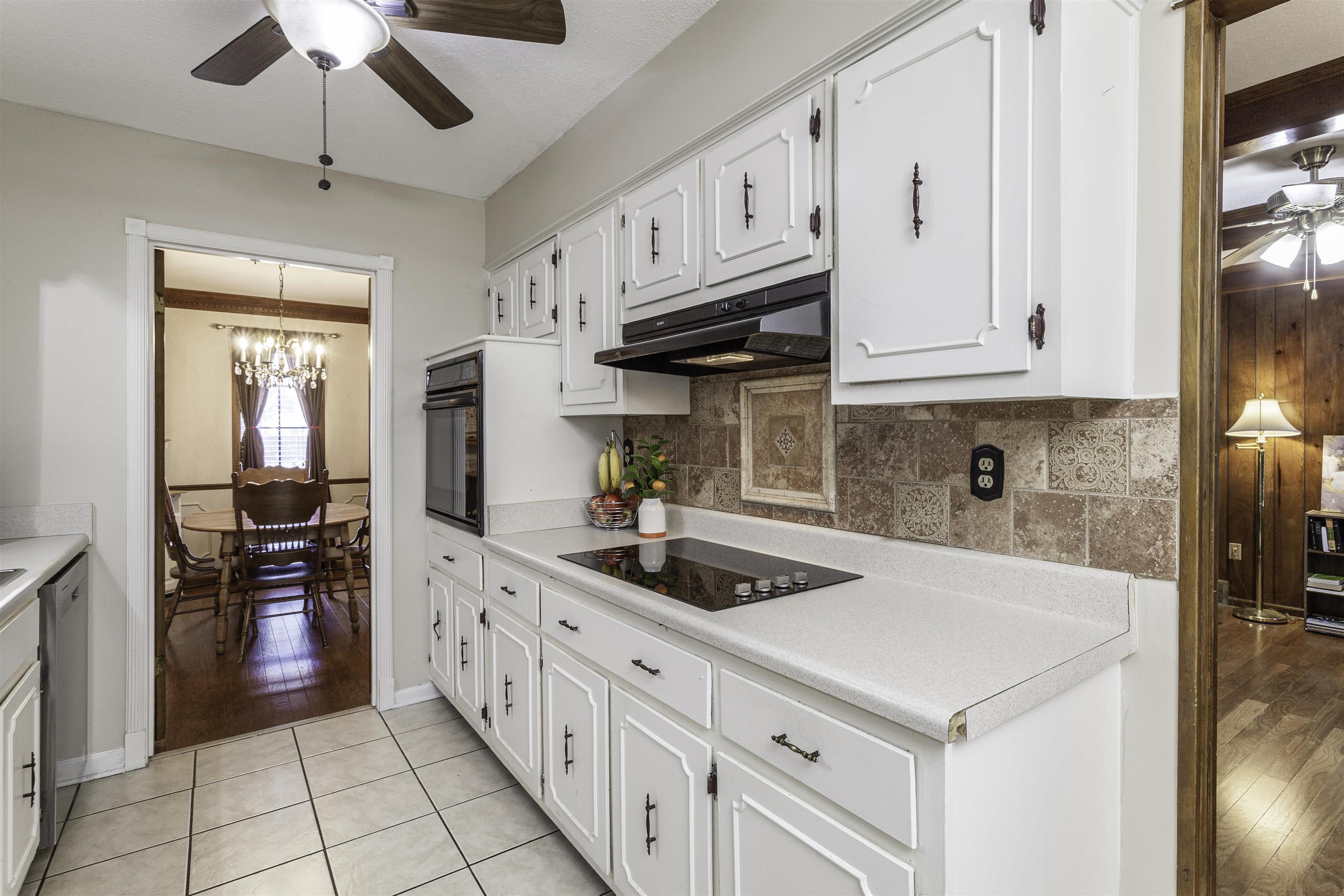 3462 Fox Meadows Road Memphis, TN 38115 - Photo 8 of 23 a kitchen with stainless steel appliances granite countertop a sink a stove and cabinets