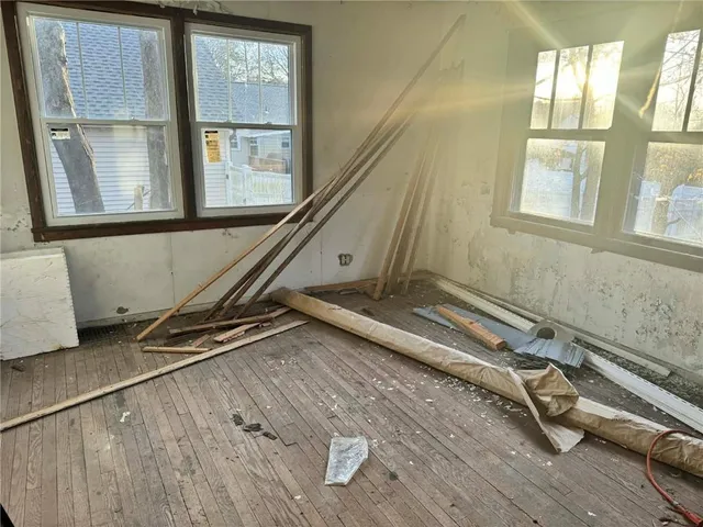 a room with gym equipment and windows