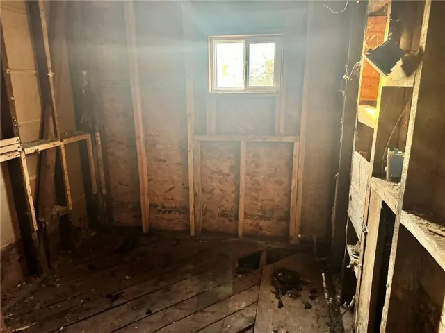 a bathroom with a shower and a sink