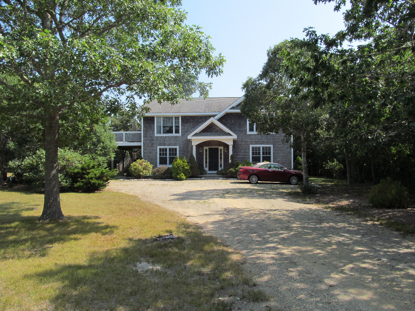 109 Herring Creek Road Edgartown, MA 02539 - Photo 1 of 16 a front view of a house with a yard