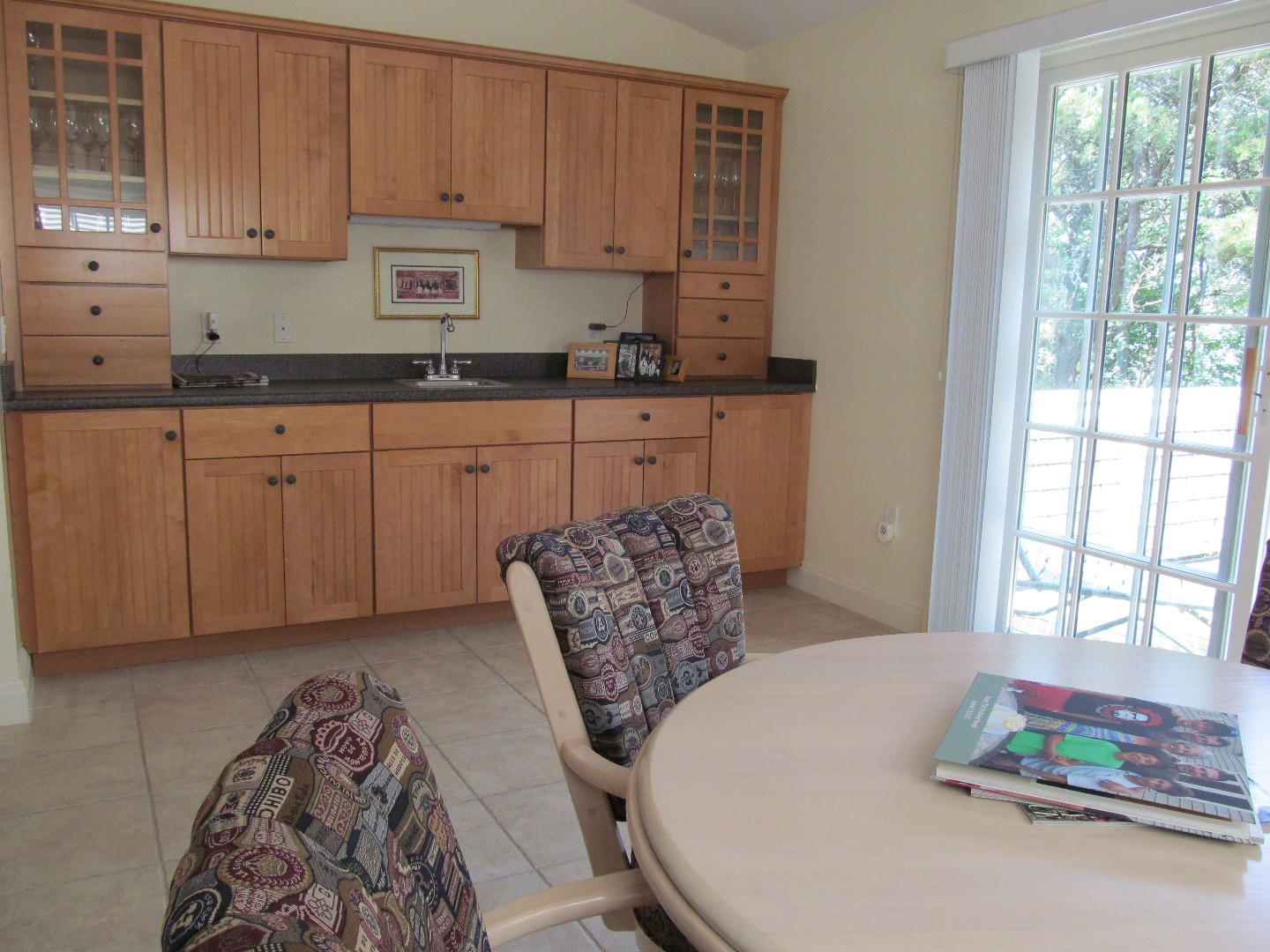 109 Herring Creek Road Edgartown, MA 02539 - Photo 11 of 16 a kitchen with stainless steel appliances granite countertop a stove a sink and white cabinets with wooden floor