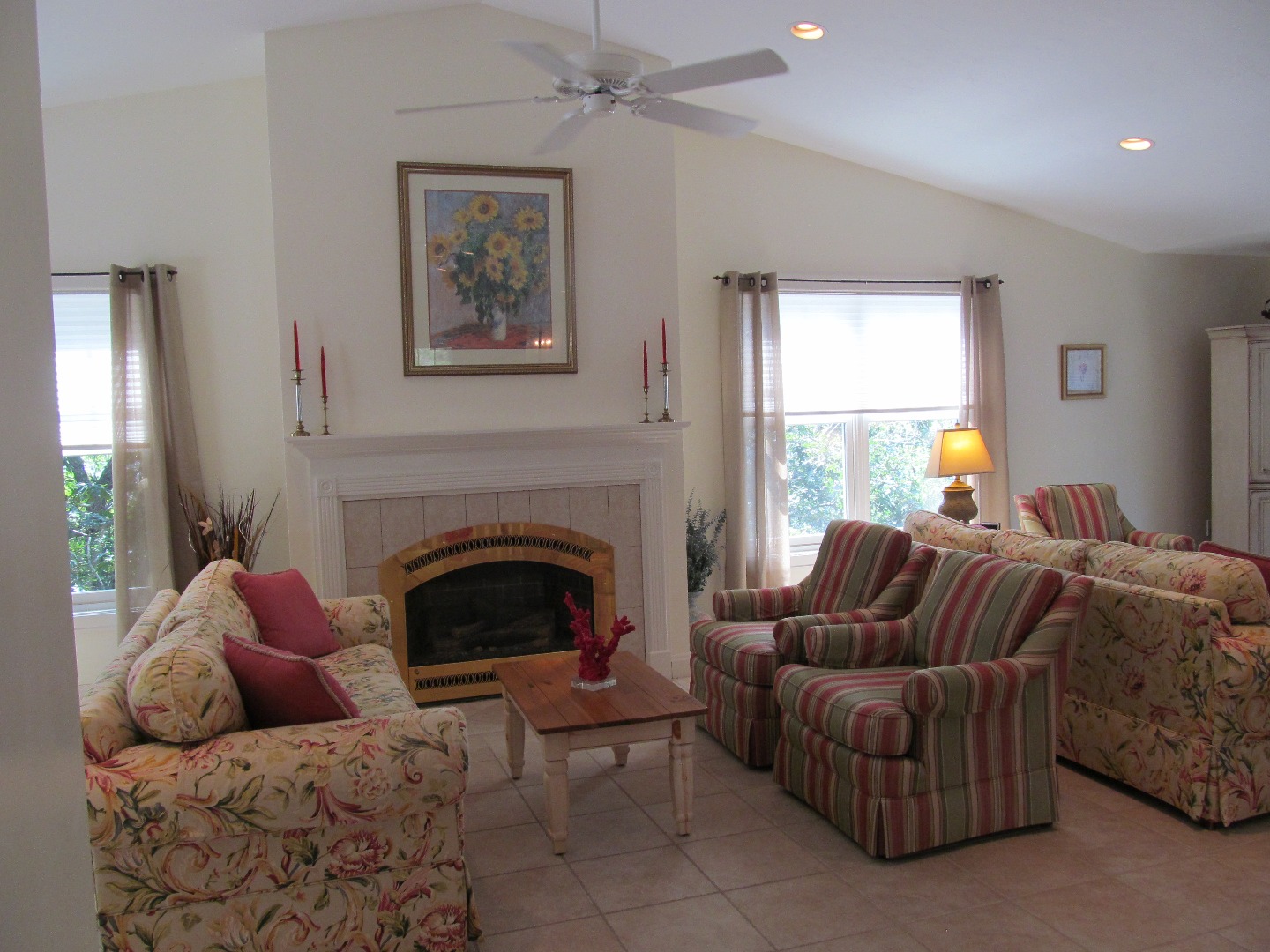 109 Herring Creek Road Edgartown, MA 02539 - Photo 2 of 16 a living room with furniture a window and a fireplace