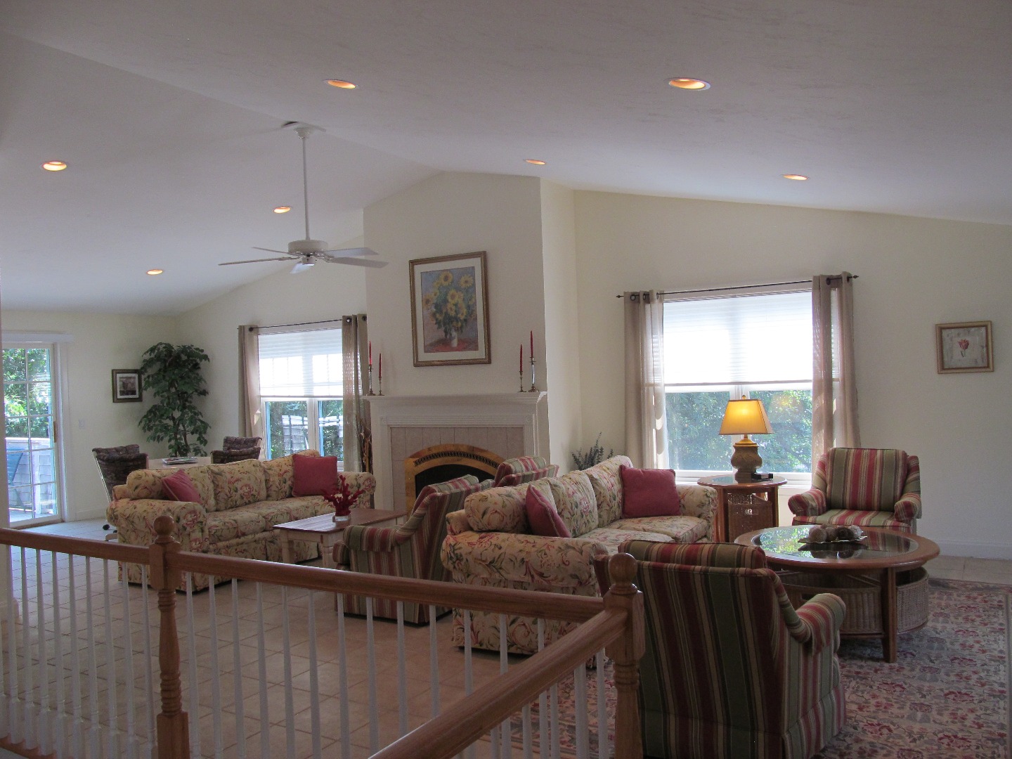 109 Herring Creek Road Edgartown, MA 02539 - Photo 3 of 16 a living room with furniture a fireplace and a potted plant