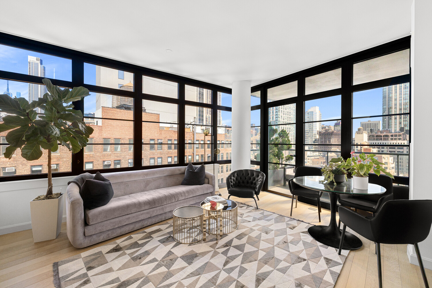 50 West 30th Street, Unit 18B Manhattan, NY 10001 - Photo 2 of 10 a living room with furniture and floor to ceiling windows