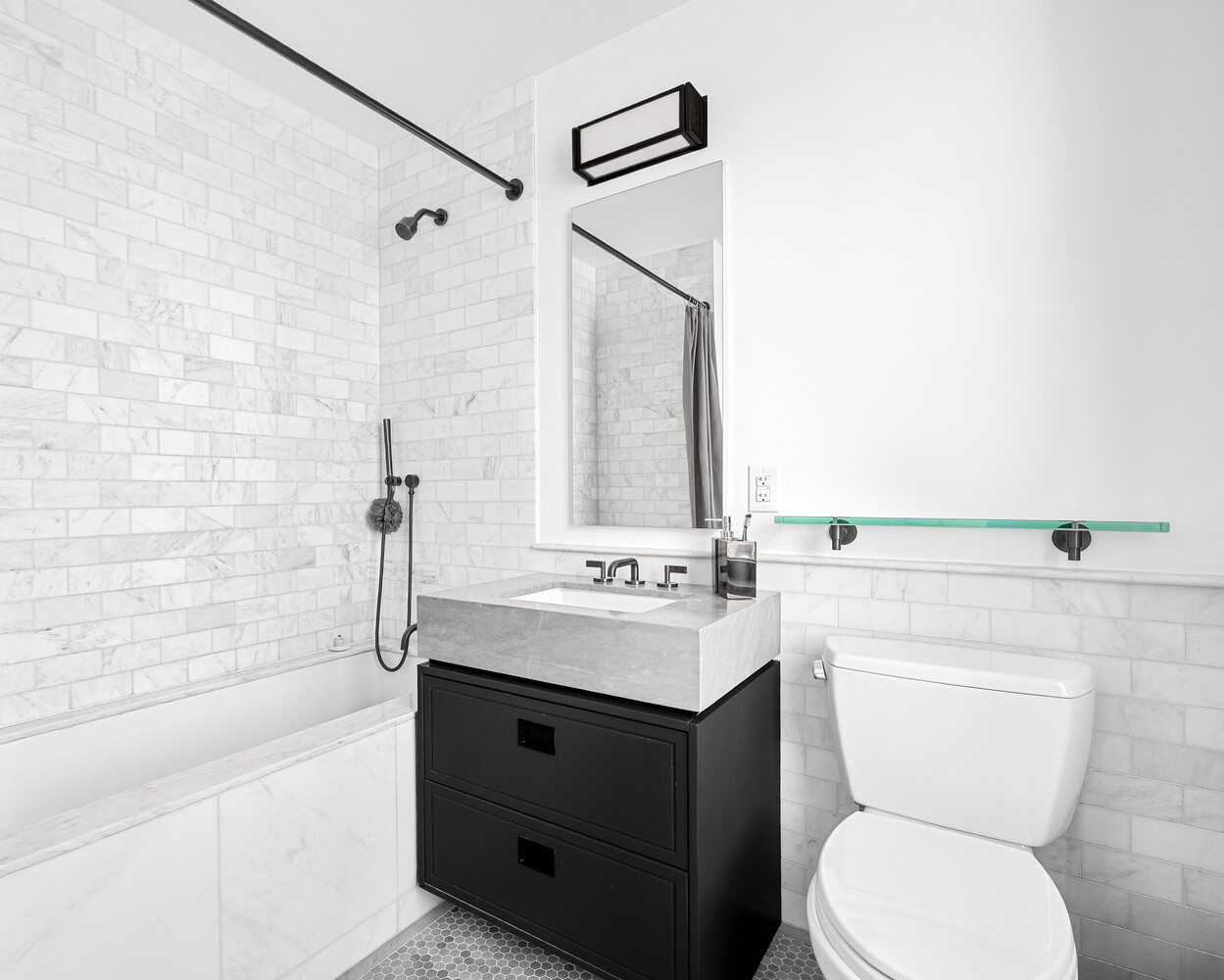 50 West 30th Street, Unit 18B Manhattan, NY 10001 - Photo 8 of 10 a bathroom with a sink a toilet and shower