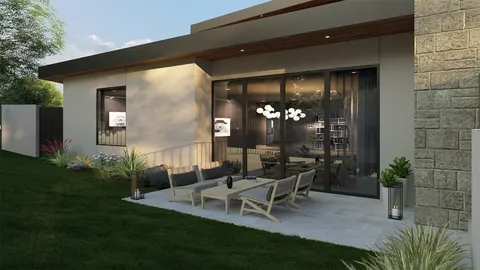 a view of backyard with plants and outdoor seating