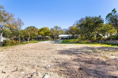 a view of swimming pool with a yard