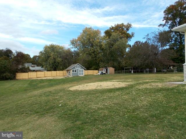 2402 Roth Road Edgewood, MD 21040 - Photo 11 of 27 a view of a green field with wooden fence