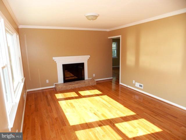 2402 Roth Road Edgewood, MD 21040 - Photo 21 of 27 a bedroom with a bed and a fireplace