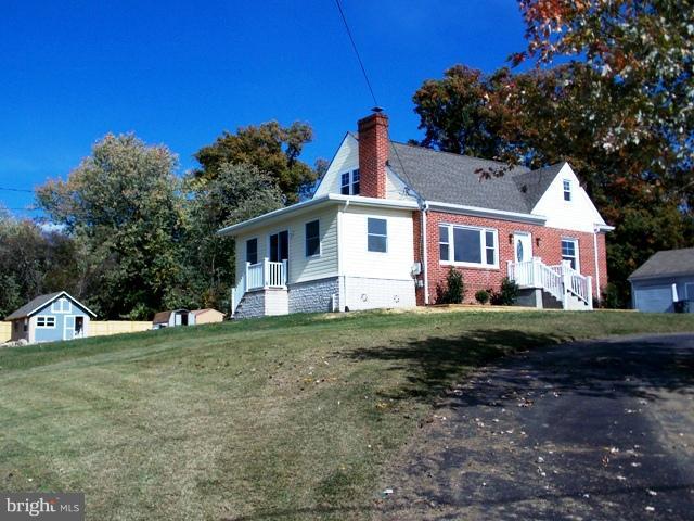 2402 Roth Road Edgewood, MD 21040 - Photo 23 of 27 a front view of a house with a yard