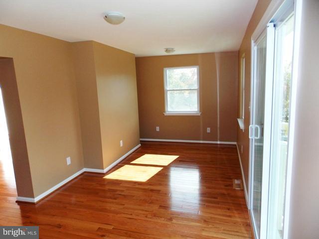 2402 Roth Road Edgewood, MD 21040 - Photo 25 of 27 a view of empty room with wooden floor and fan