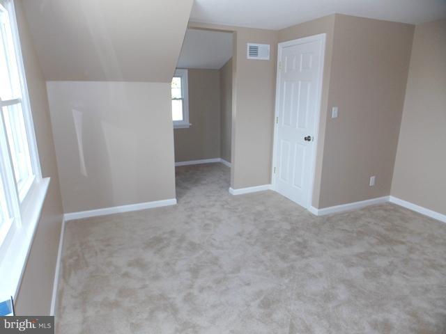2402 Roth Road Edgewood, MD 21040 - Photo 26 of 27 an empty room with windows and closet