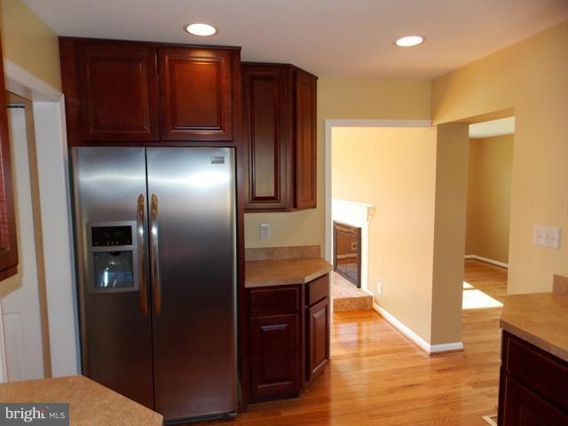 2402 Roth Road Edgewood, MD 21040 - Photo 5 of 27 a kitchen with stainless steel appliances granite countertop a refrigerator and a sink