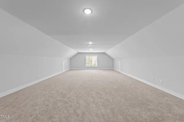 a view of a wooden deck and a backyard