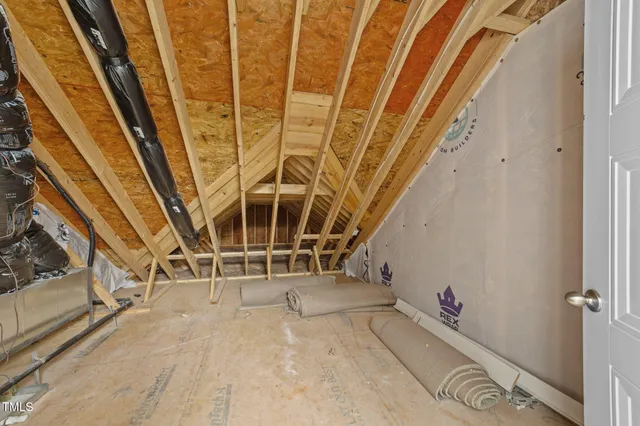 a view of a livingroom with wooden floor and a ceiling fan