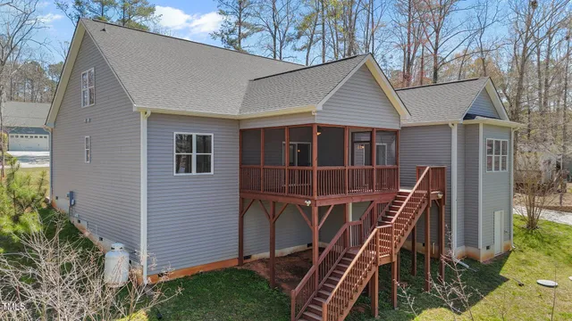 a view of swimming pool with outdoor seating and plants