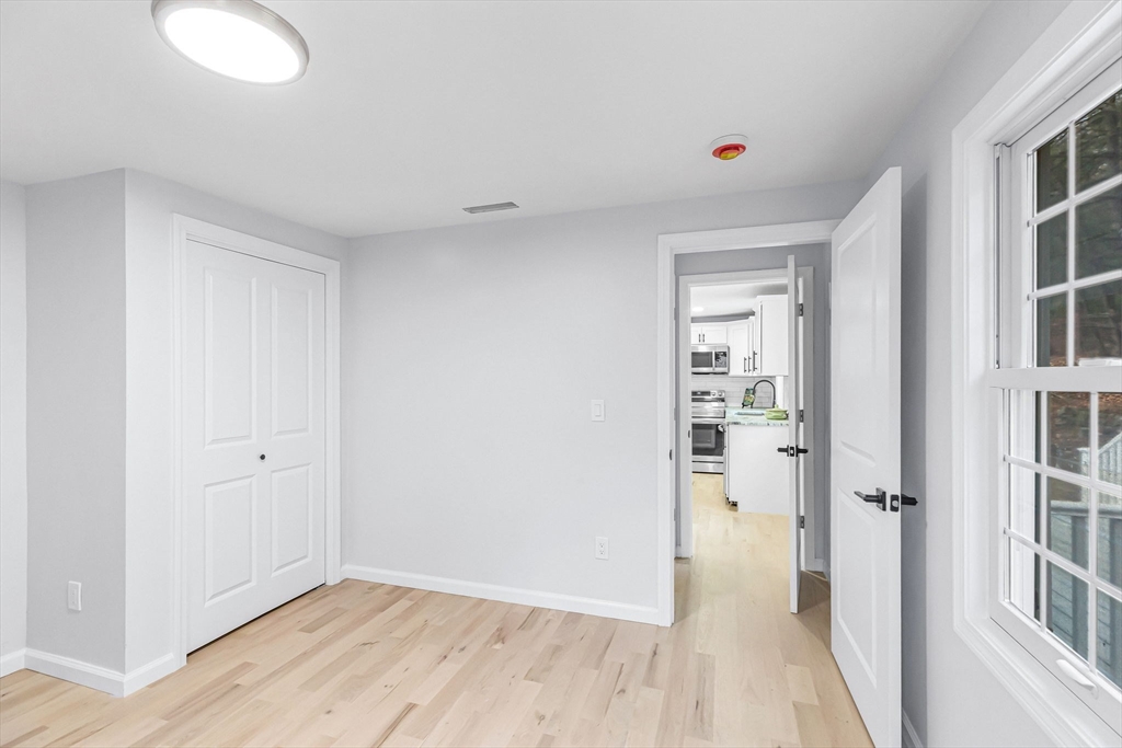 143 James Street Ludlow, MA 01056 - Photo 19 of 41 a view of a room with wooden floor and windows