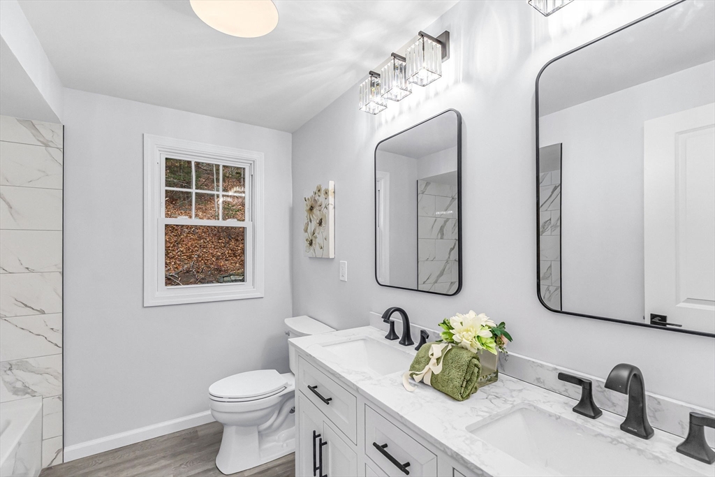 143 James Street Ludlow, MA 01056 - Photo 30 of 41 a bathroom with a toilet sink and mirror