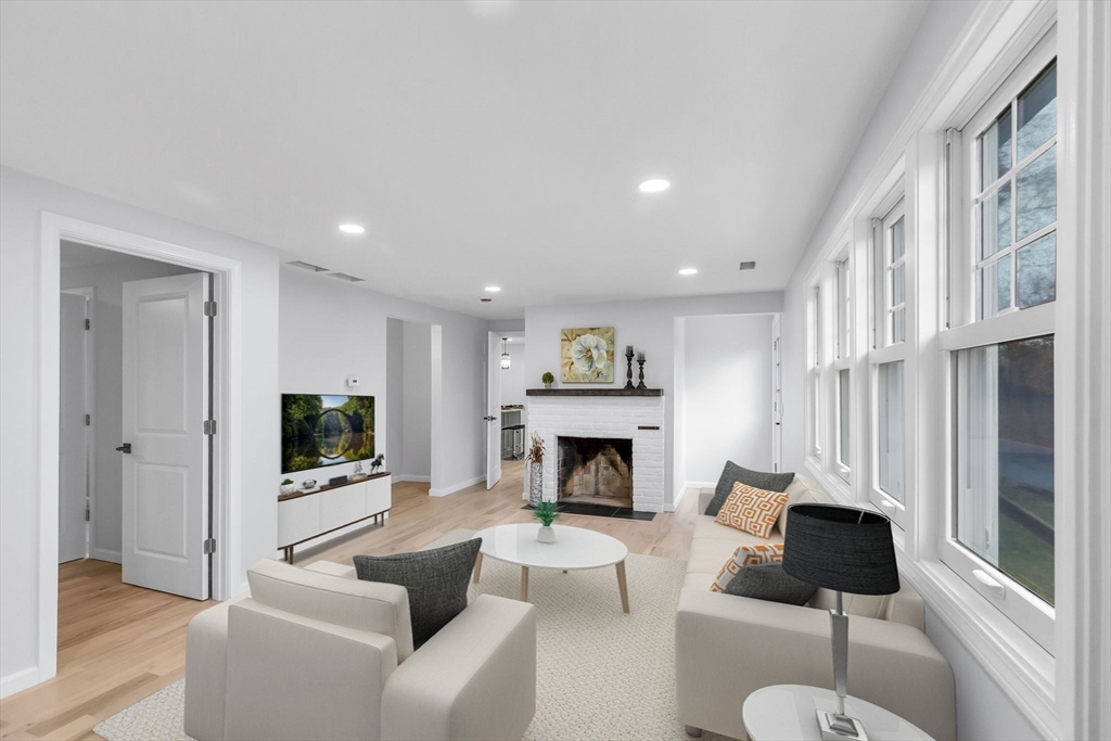 143 James Street Ludlow, MA 01056 - Photo 3 of 41 a living room with furniture and a fireplace