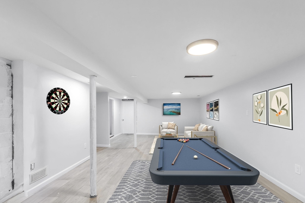 143 James Street Ludlow, MA 01056 - Photo 35 of 41 a living room with a couch and paintings on the wall