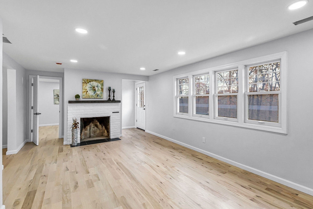 143 James Street Ludlow, MA 01056 - Photo 4 of 41 a view of an empty room with wooden floor and a window