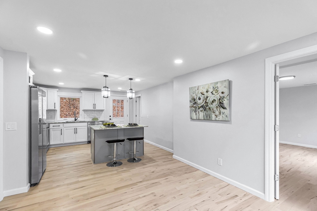 143 James Street Ludlow, MA 01056 - Photo 8 of 41 a kitchen with stainless steel appliances a dining table chairs and view living room