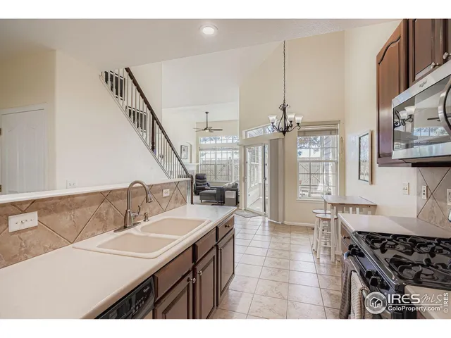 a kitchen with sink cabinets and stove