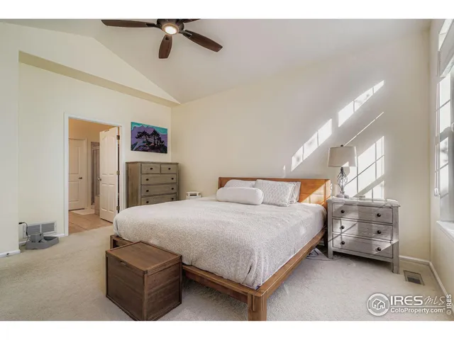 a bedroom with a bed and dresser