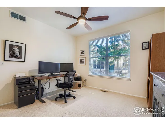 a work room with furniture and a window