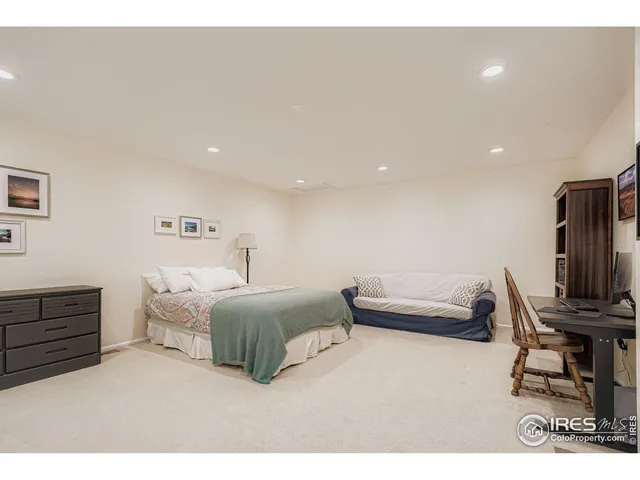 a bedroom with a bed and furniture