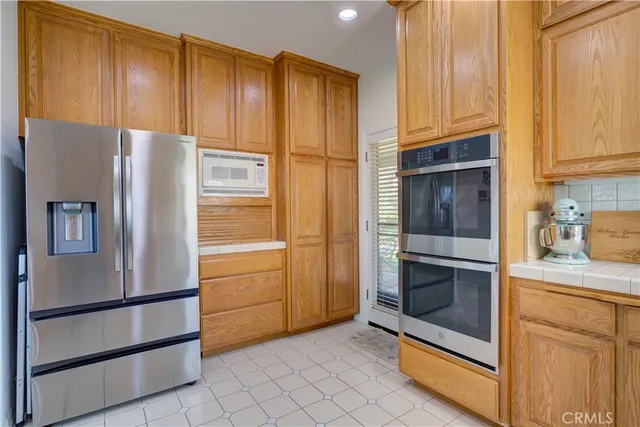 a bedroom with a bed and a lamp