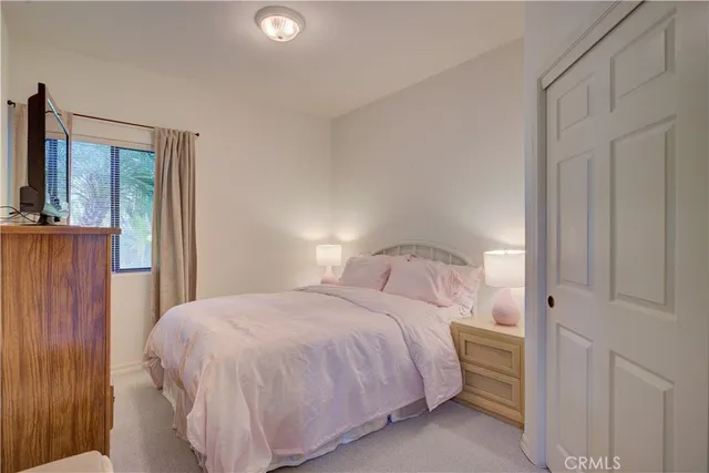 a living room with furniture potted plant a fireplace and a window