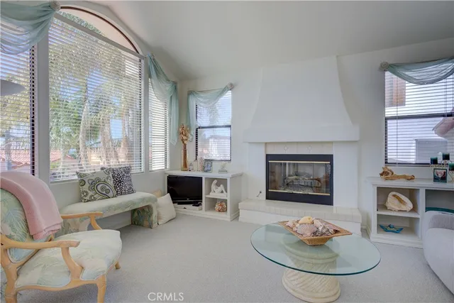 a bedroom with a bed and a potted plant on dresser