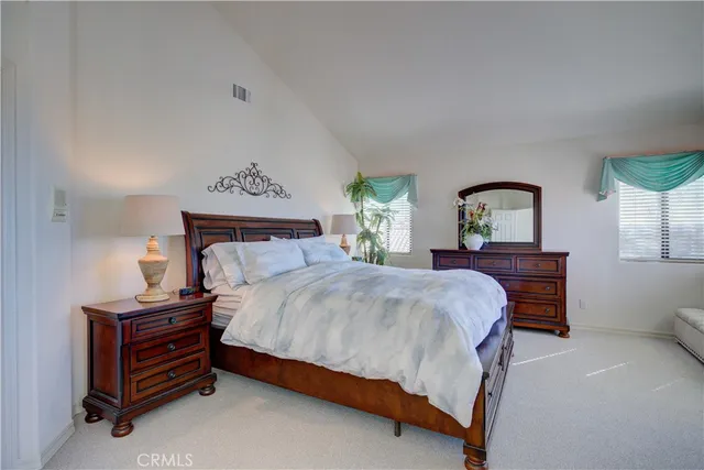 a bathroom with a granite countertop sink mirror and toilet