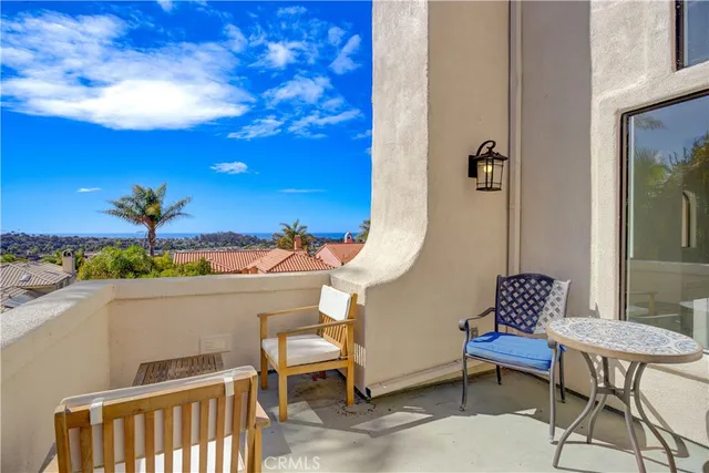 an aerial view of residential building with green space