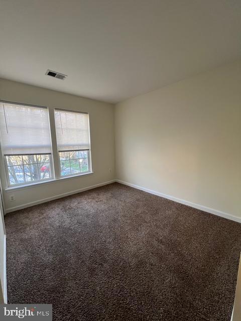 18704 Harmony Woods Lane Germantown, MD 20874 - Photo 13 of 21 an empty room with windows