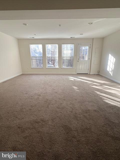 18704 Harmony Woods Lane Germantown, MD 20874 - Photo 17 of 21 a view of an empty room with windows