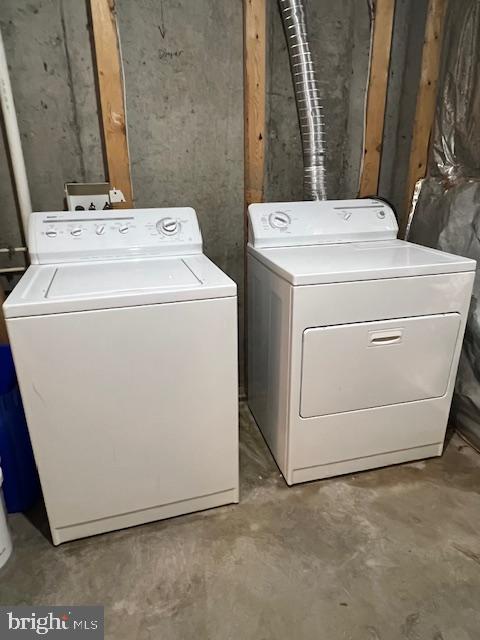 18704 Harmony Woods Lane Germantown, MD 20874 - Photo 19 of 21 a utility room with dryer and washer