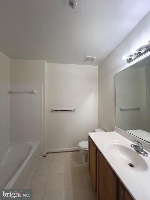 18704 Harmony Woods Lane Germantown, MD 20874 - Photo 9 of 21 a bathroom with a sink and a mirror