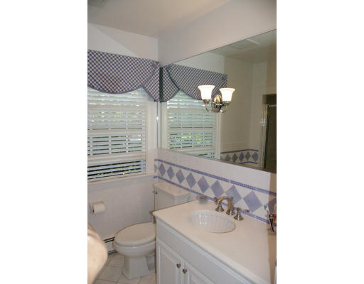 69 Bonwood Road Needham, MA 02492 - Photo 12 of 15 a bathroom with a sink and a mirror