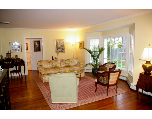 69 Bonwood Road Needham, MA 02492 - Photo 2 of 15 a living room with dining room and wooden floor