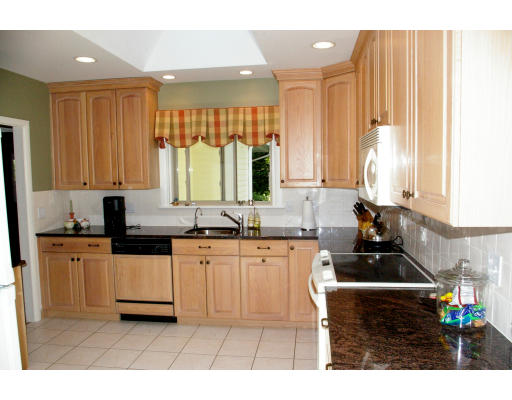 69 Bonwood Road Needham, MA 02492 - Photo 10 of 15 a kitchen with stainless steel appliances a sink stove and cabinets