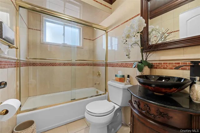a bathroom with a toilet a sink and bathtub