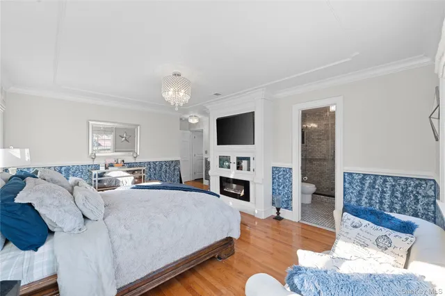 a living room with furniture fireplace and flat screen tv
